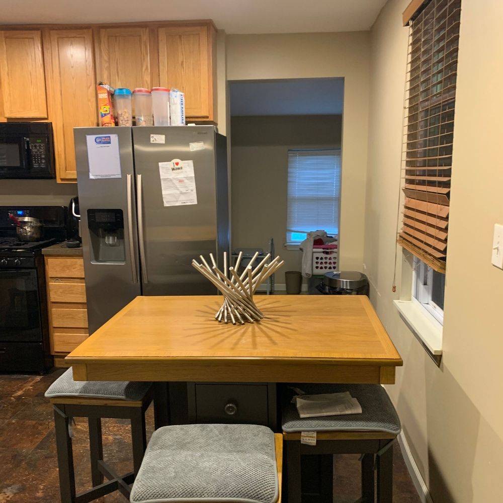 Tidy dining area with polished hardwood floor